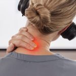 Call center, neck pain and injury with business woman in office for inflammation, burnout and stress. Accident, tired and strain with closeup of female employee for emergency, frustrated and problem.